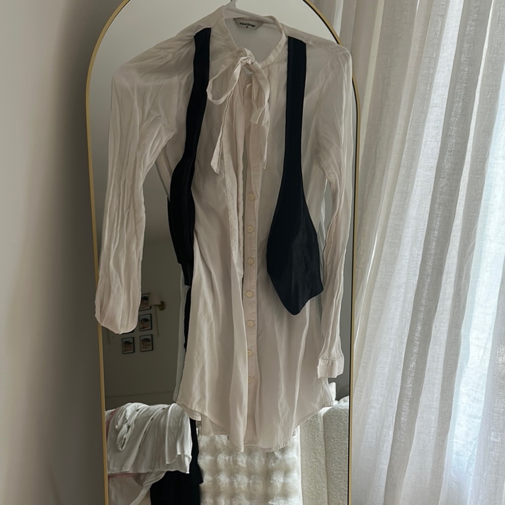 Elegant White Blouse with Black Vest